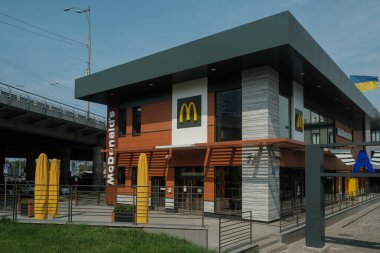 Kyiv, Ukraine - August 11, 2022: McDonald's Restaurant in Kyiv near Central Bus Station. After russian invasion in Ukraine on 24th of February, all restaurants have been temporarily closed. clipart