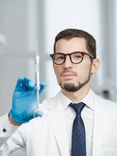 Closeup Portrait Male Doctor Holding Cartridge Syringe White Dental Office — Foto de Stock