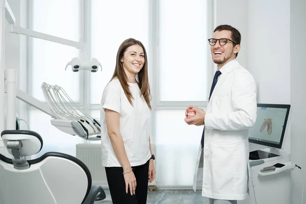 Happy Male Dentist Standing Dental Unit Caucasian Female Patient Smile — Stok fotoğraf