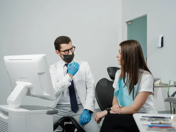 Male Orthodontist Female Patient Looking Screen Dental Consultation Visit — Stock Photo, Image