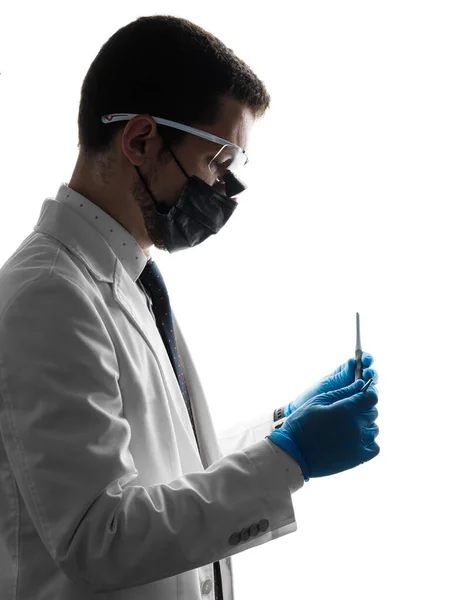 Silhouette Male Dentist Wearing Magnifying Binocular Holding Medical Equipment Hands 免版税图库图片
