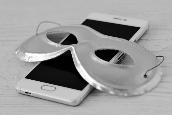 Mask on mobile phone - Concept of privacy, security and anonymity of mobile phones