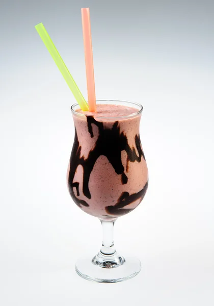 Cocktail with black chocolate over white background