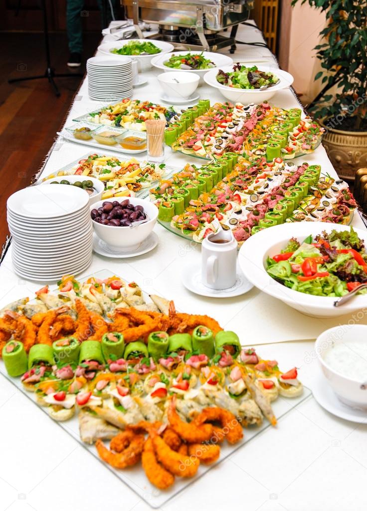 Table with various delicious appetizer