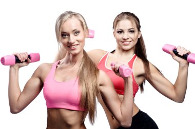 iki güzel genç kadın fitness egzersiz dumbbells ile yapmak