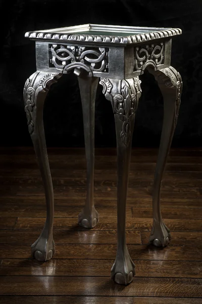 Vintage wooden table painted with silver color with carved legs — Stock Photo, Image