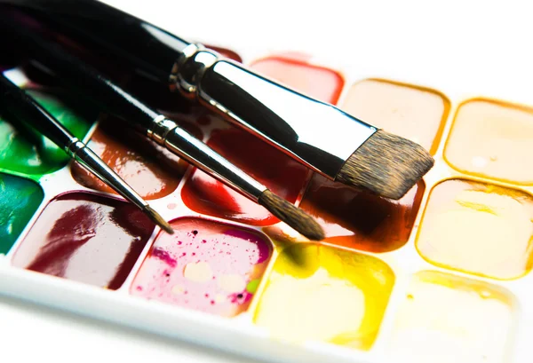 Watercolor paintbox and paintbrushes close-up — Stock Photo, Image