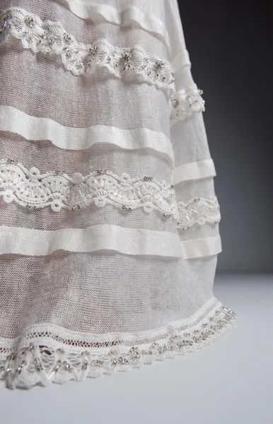 Λεπτομέρεια από το λευκό φόρεμα πλεκτό — Φωτογραφία Αρχείου