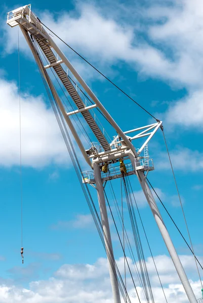 Barge crane over blue sky background — Stock Photo, Image