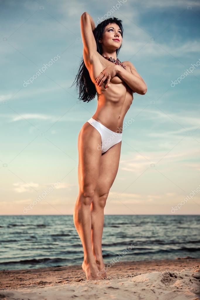 Sexy brunette girl Topless on the Beach