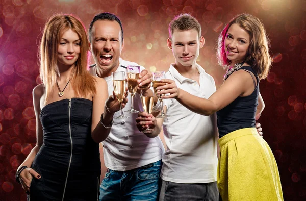 Group of young people with glasses of sparkling champagne — Stock Photo, Image