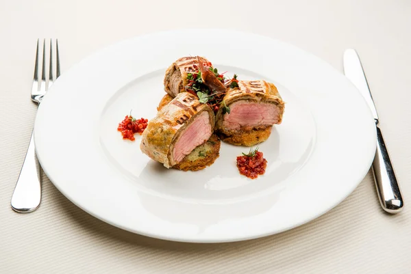 Roasted juicy beef steak with potato pancakes — Stock Photo, Image