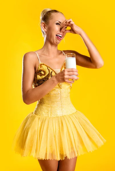 Ballerina with glass of milk — Stock Photo, Image