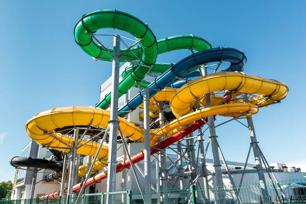 Tube slides at water park against blue sky — Stock Photo, Image