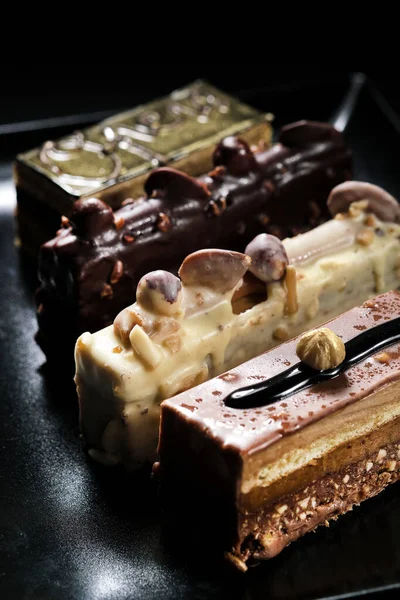 Close Vertical View Four Diverse Chocolate Desserts Plate — Stock Photo, Image