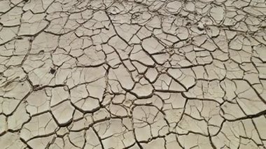 Aerial shot, drone point of view old abandoned mines of Mazarron in Murcia, sunny day. Scratched dry land textured surface background, full frame shot. Brown, beige colors, no people. Spain