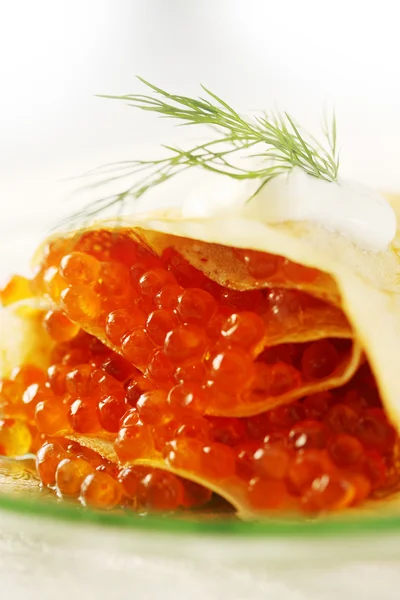 Eggs in pancakes — Stock Photo, Image