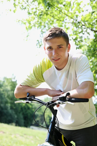 Young guy on a bike — Stock Photo, Image
