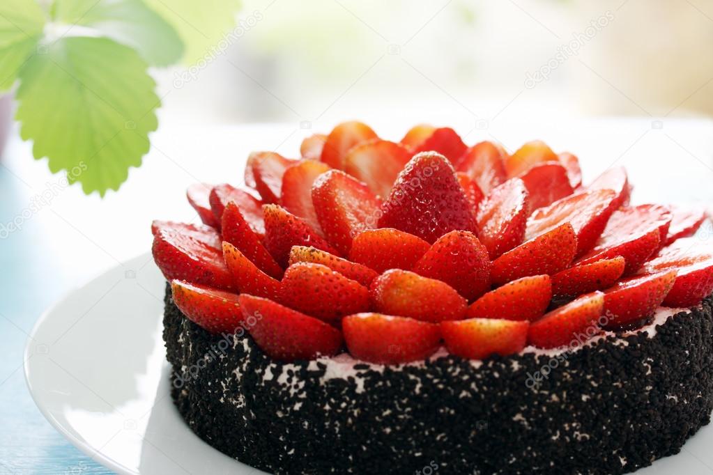 cake decorated with strawberry halves