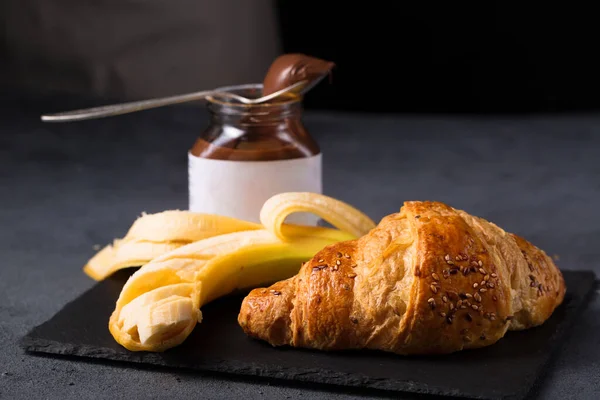 Crispy croissant with peanut butter and banana