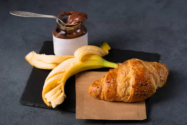 Crispy croissant with peanut butter and banana