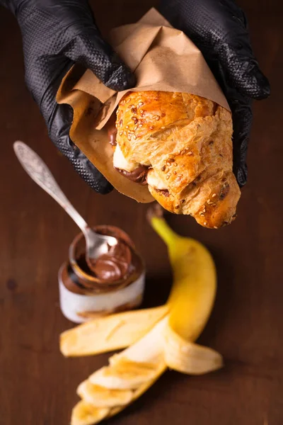 Crispy croissant with peanut butter and banana