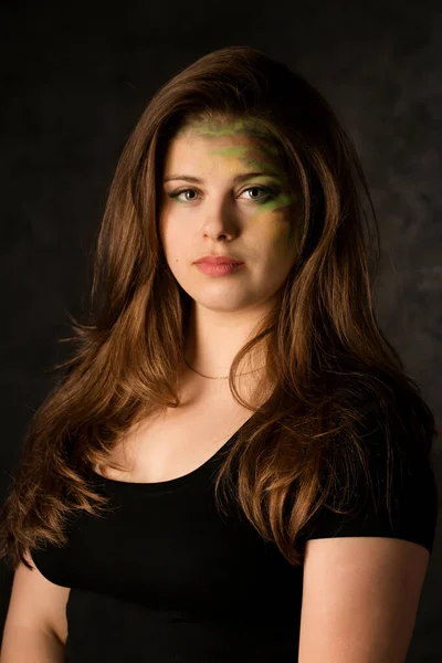 Young Woman Camouflage Makeup Dark Background — Stock Fotó