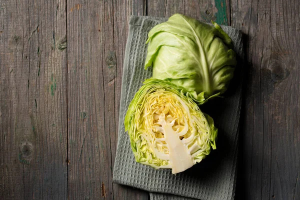 Young Early Cabbage Cut Half Dark Background — Zdjęcie stockowe