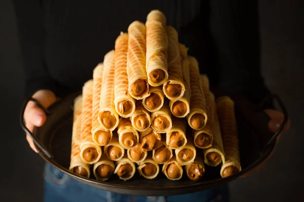 Ruddy Crispy Tubes Condensed Milk Metal Tray Woman Hands — Fotografia de Stock