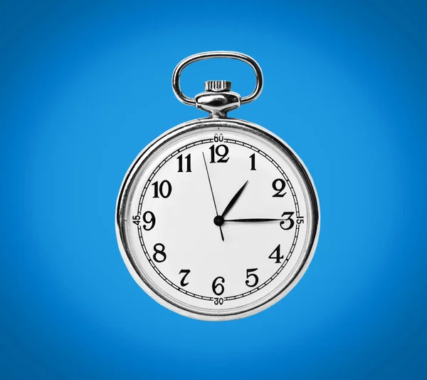 Clock isolated on blue background — Stock Photo, Image