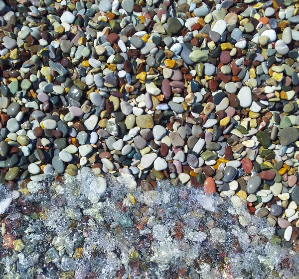 Beach stones and water — Stock Photo, Image