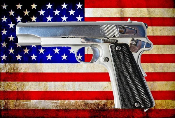 Gun and USA flag — Stock Photo, Image