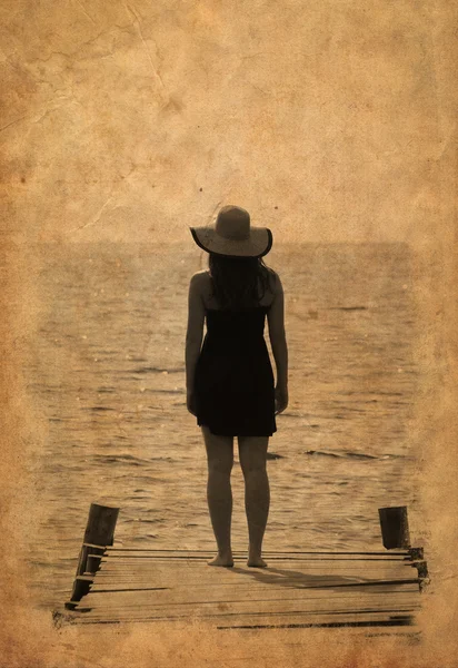 Vintage image of woman waiting on dock — Stock Photo, Image