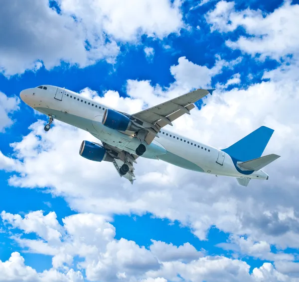 Passenger airplane against blue sky Stock Photo