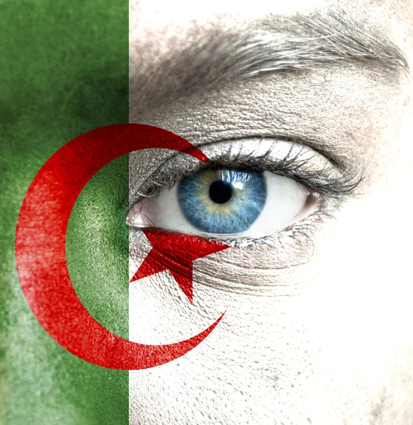 Human face painted with flag of Algeria — Stock Photo, Image