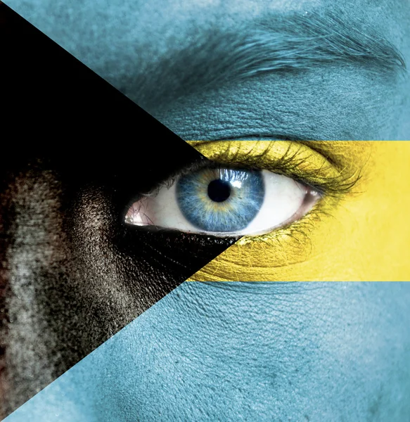 Human face painted with flag of Bahamas — Stock Photo, Image