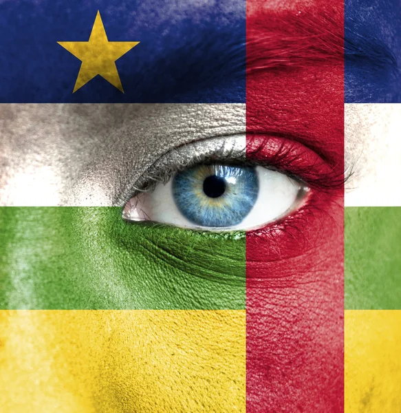 Human face painted with flag of Central African Republic — Stock Photo, Image