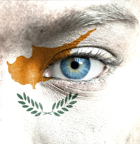 Human face painted with flag of Cyprus — Stock Photo, Image