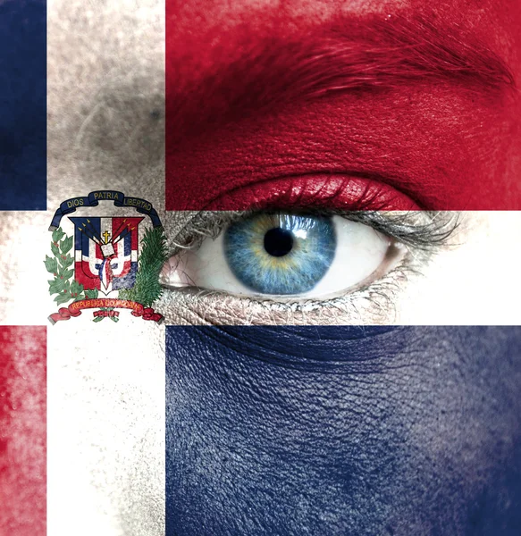 Human face painted with flag of Dominican Republic — Stock Photo, Image