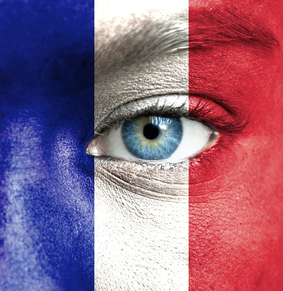 Human face painted with flag of France — Stock Photo, Image