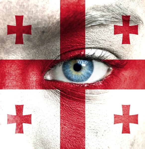 Human face painted with flag of Georgia — Stock Photo, Image