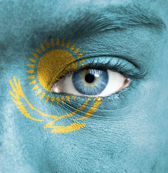 Human face painted with flag of Kazakhstan — Stock Photo, Image