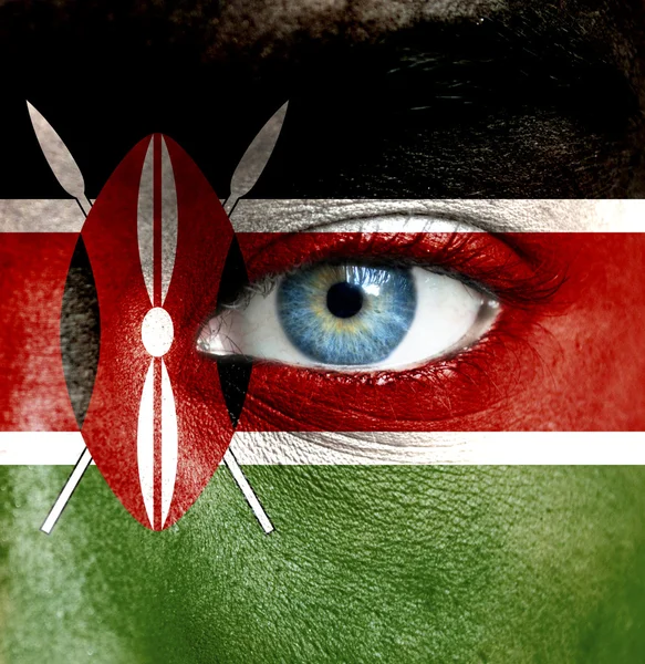 Human face painted with flag of Kenya — Stock Photo, Image