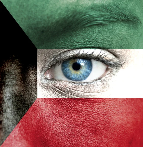 Human face painted with flag of Kuwait — Stock Photo, Image
