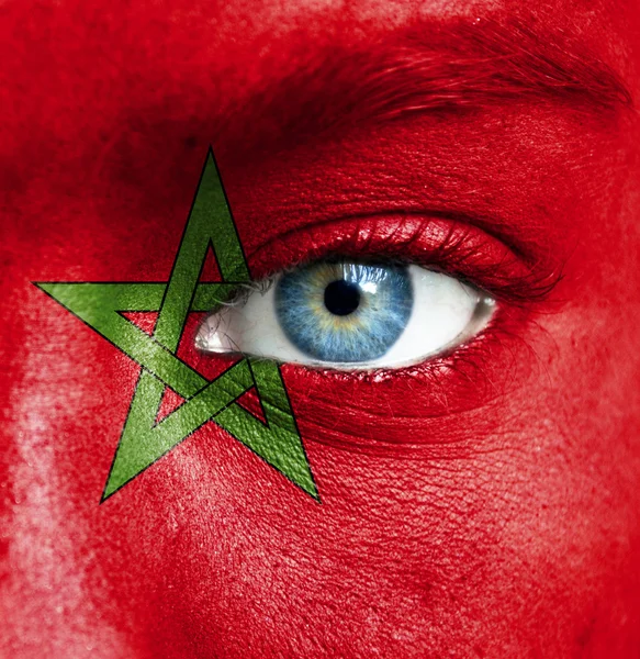 Human face painted with flag of Morocco — Stock Photo, Image