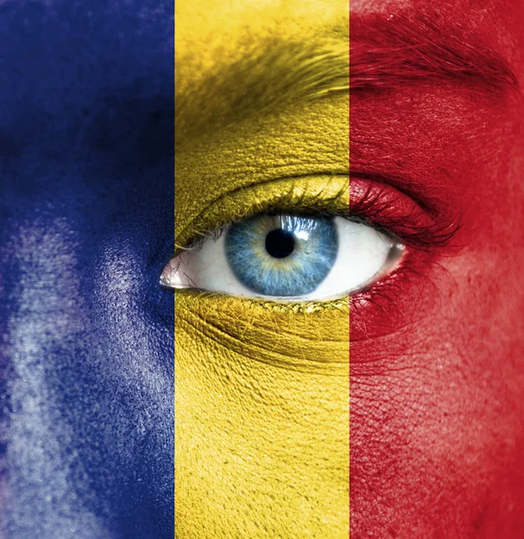 Human face painted with flag of Romania — Stock Photo, Image