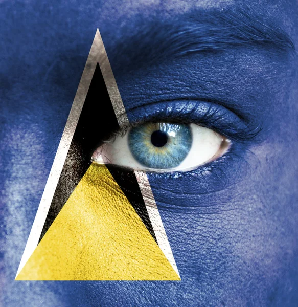 Human face painted with flag of Saint Lucia — Stock Photo, Image