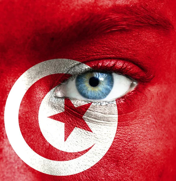 Ludzka twarz malowane z Flaga Tunezji — Zdjęcie stockowe