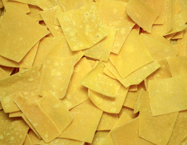 Square shaped pasta background — Stock Photo, Image