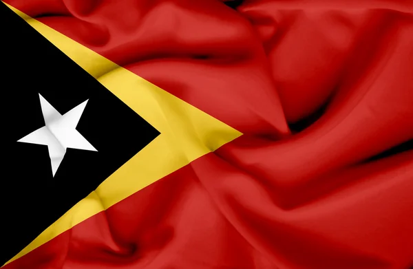 Timor Oriental ondeando bandera — Foto de Stock
